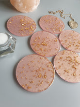 Load image into Gallery viewer, Resin Coaster Gifts, Pink Shimmer with gold foil resin coaster made the perfect size for wine glasses and cups of all sizes. Unique resin coaster will make a great housewarming, engagement gift or present for any occasion. Handmade functional art that brightens your office or home decor. Resin coaster set custom made to order.
